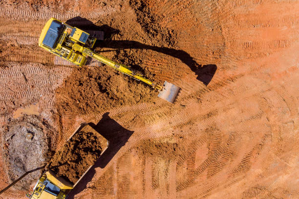 Heavy machinery working on a large-scale earthworks site